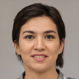 Joyful white young-adult female with medium  brown hair and brown eyes