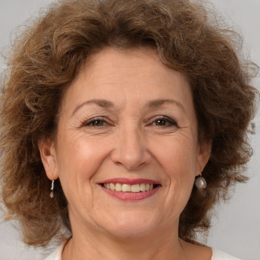 Joyful white middle-aged female with medium  brown hair and brown eyes