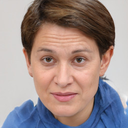 Joyful white adult female with short  brown hair and brown eyes