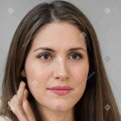 Joyful white young-adult female with long  brown hair and brown eyes