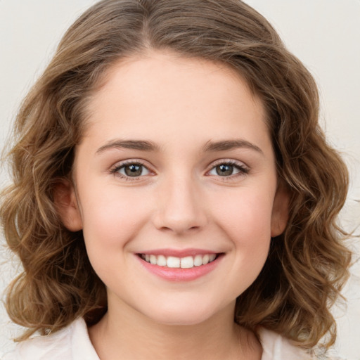 Joyful white young-adult female with medium  brown hair and green eyes