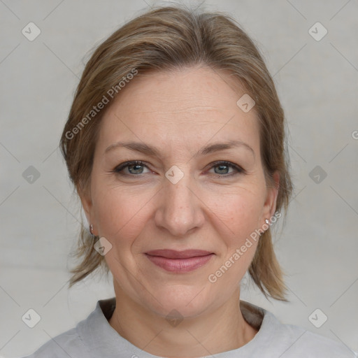 Joyful white adult female with medium  brown hair and grey eyes