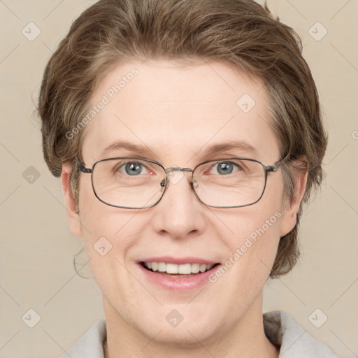 Joyful white adult female with medium  brown hair and blue eyes