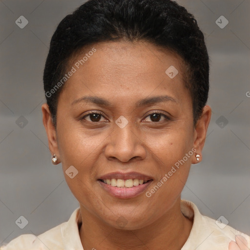 Joyful latino adult female with short  brown hair and brown eyes