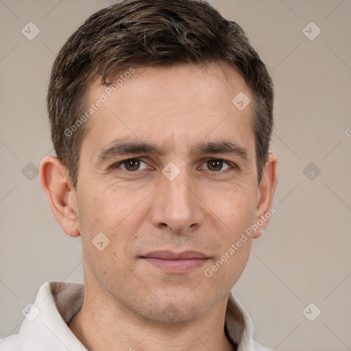 Joyful white adult male with short  brown hair and brown eyes