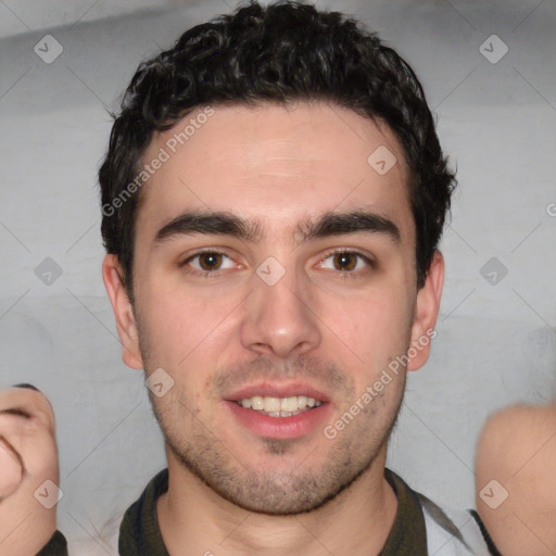 Joyful white young-adult male with short  black hair and brown eyes