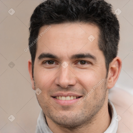 Joyful white young-adult male with short  black hair and brown eyes