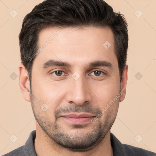 Joyful white young-adult male with short  brown hair and brown eyes