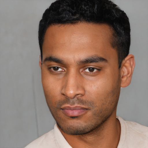 Neutral latino young-adult male with short  black hair and brown eyes