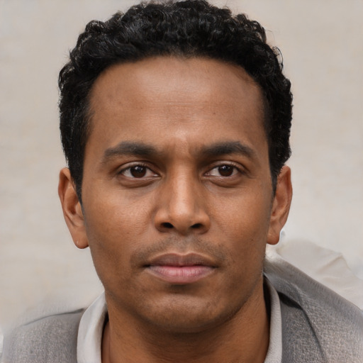 Neutral black young-adult male with short  brown hair and brown eyes