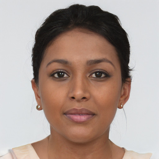 Joyful asian young-adult female with short  brown hair and brown eyes
