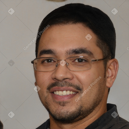 Joyful white young-adult male with short  black hair and brown eyes