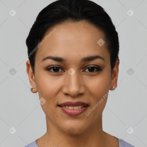 Joyful latino young-adult female with short  black hair and brown eyes