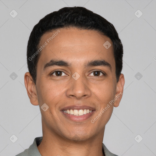 Joyful latino young-adult male with short  black hair and brown eyes