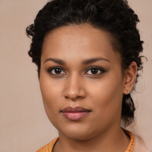 Neutral black young-adult female with long  brown hair and brown eyes