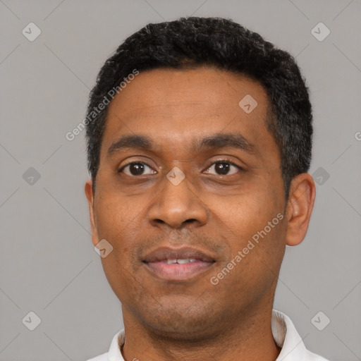 Neutral latino young-adult male with short  black hair and brown eyes