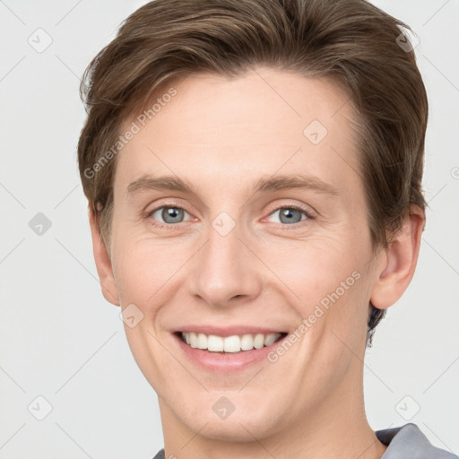 Joyful white young-adult female with short  brown hair and grey eyes