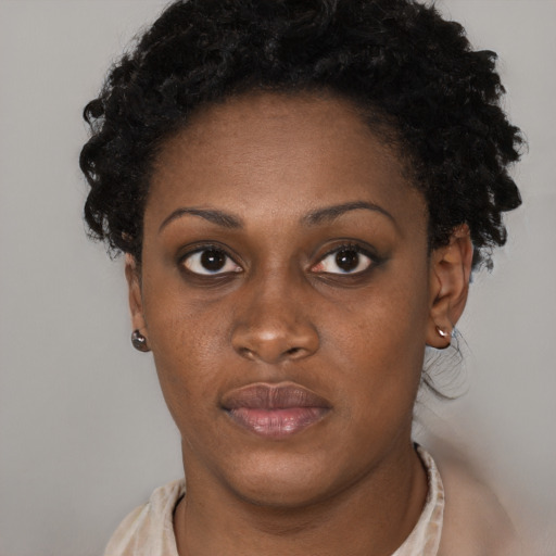 Neutral black young-adult female with short  brown hair and brown eyes