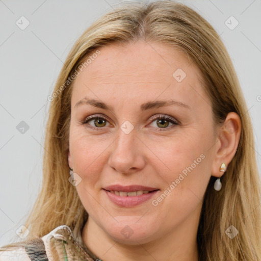 Joyful white adult female with long  brown hair and brown eyes