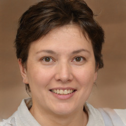 Joyful white adult female with short  brown hair and brown eyes