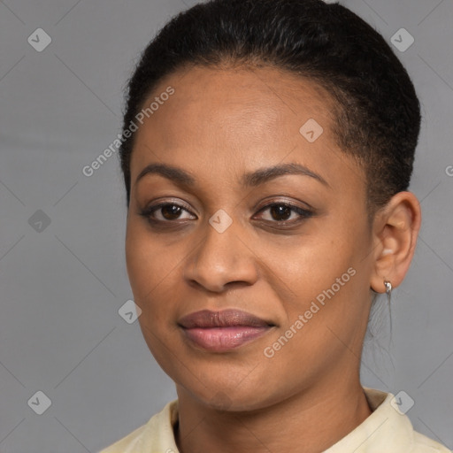 Joyful black young-adult female with short  brown hair and brown eyes