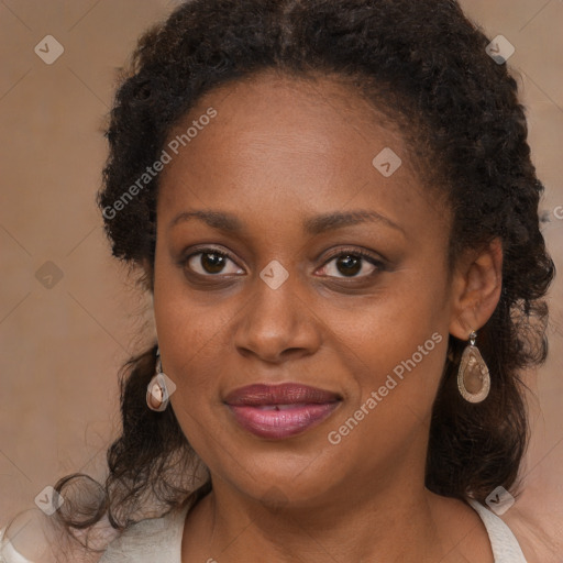 Joyful black adult female with medium  brown hair and brown eyes