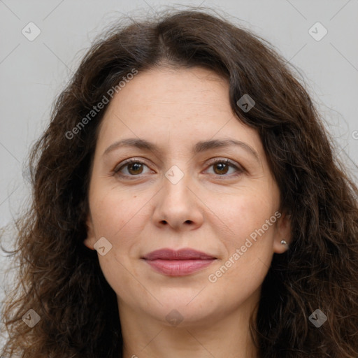 Joyful white adult female with long  brown hair and brown eyes