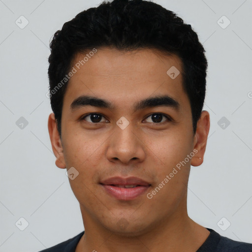 Joyful latino young-adult male with short  black hair and brown eyes