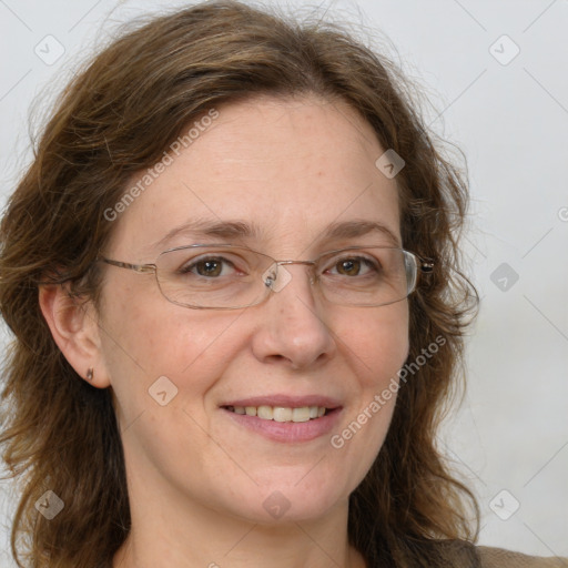 Joyful white adult female with medium  brown hair and green eyes