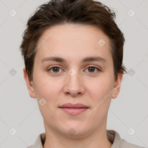 Joyful white young-adult female with short  brown hair and grey eyes