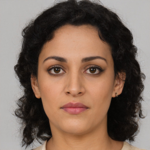 Neutral latino young-adult female with medium  brown hair and brown eyes