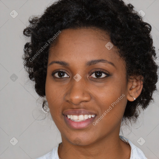 Joyful black young-adult female with medium  black hair and brown eyes