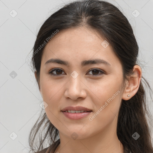 Joyful white young-adult female with long  brown hair and brown eyes