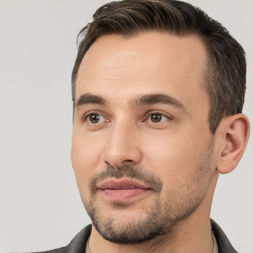 Joyful white young-adult male with short  brown hair and brown eyes