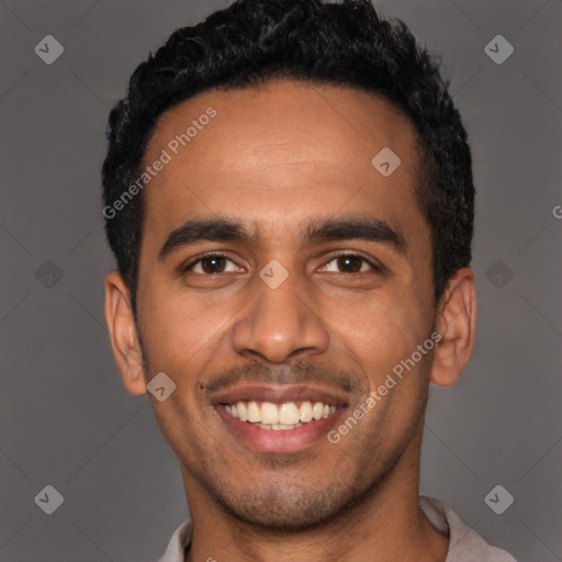 Joyful latino young-adult male with short  black hair and brown eyes