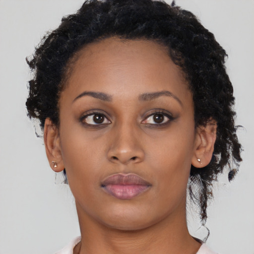 Neutral latino young-adult female with short  brown hair and brown eyes