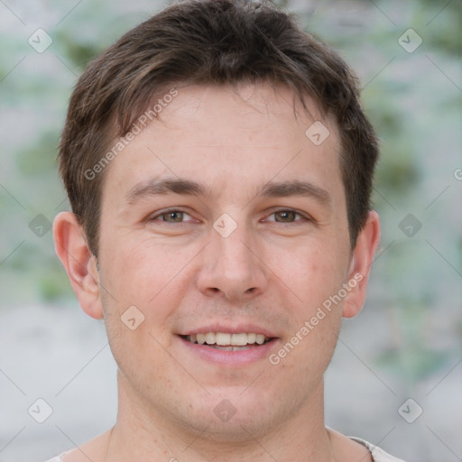 Joyful white adult male with short  brown hair and brown eyes