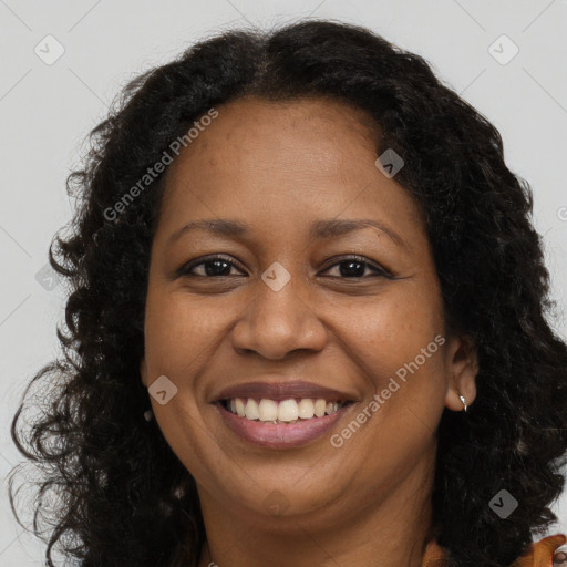 Joyful latino adult female with long  brown hair and brown eyes