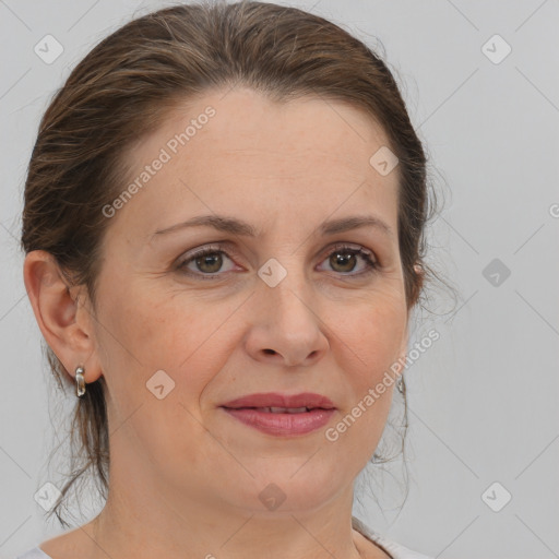 Joyful white adult female with medium  brown hair and brown eyes