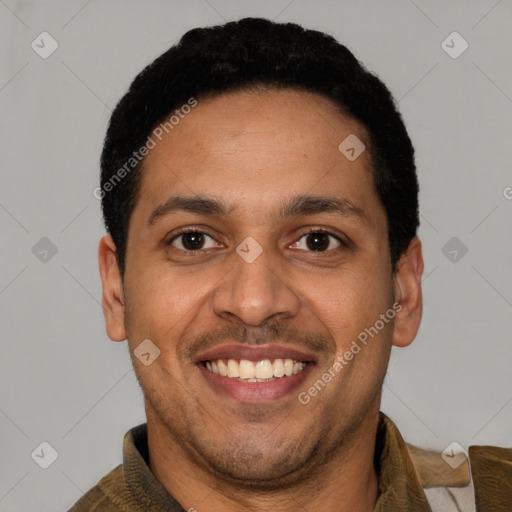 Joyful latino young-adult male with short  black hair and brown eyes