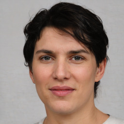 Joyful white young-adult male with medium  brown hair and brown eyes