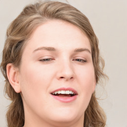 Joyful white young-adult female with medium  brown hair and blue eyes