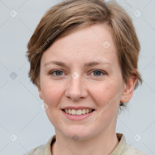 Joyful white young-adult female with medium  brown hair and blue eyes