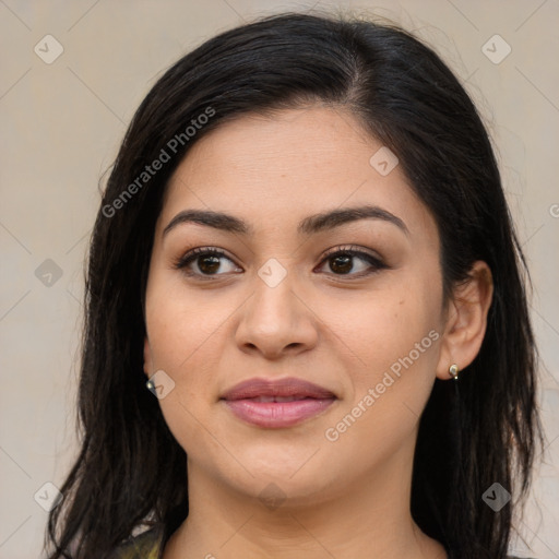 Joyful latino young-adult female with long  brown hair and brown eyes