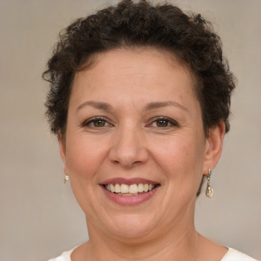 Joyful white adult female with short  brown hair and brown eyes