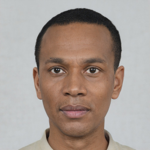 Neutral black young-adult male with short  black hair and brown eyes