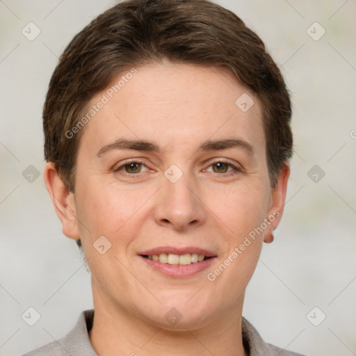 Joyful white adult female with short  brown hair and grey eyes