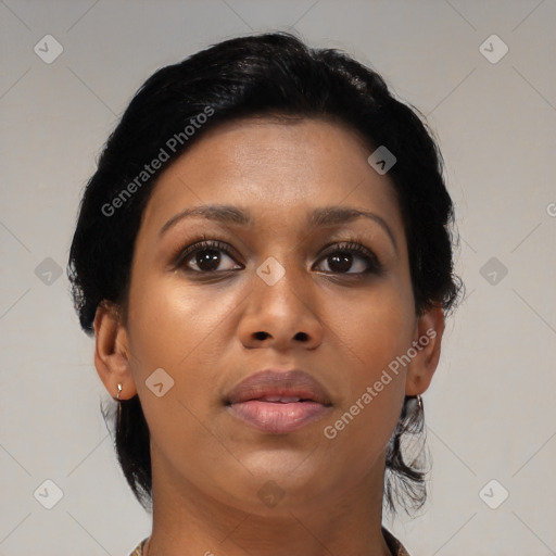 Joyful black young-adult female with medium  brown hair and brown eyes