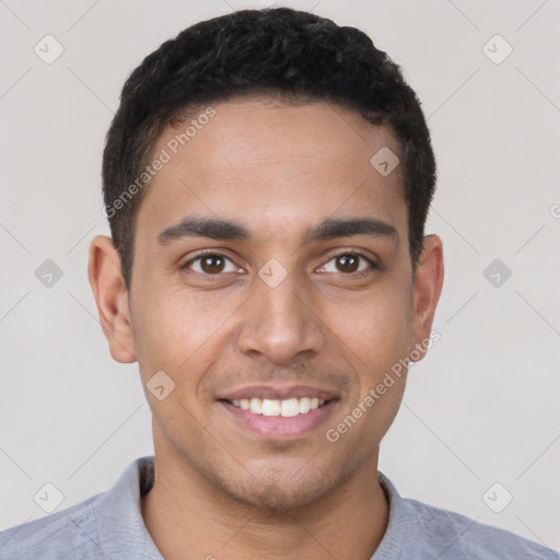 Joyful latino young-adult male with short  brown hair and brown eyes