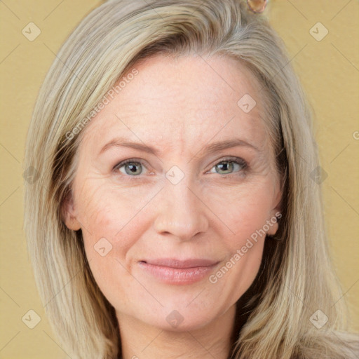 Joyful white adult female with long  brown hair and grey eyes